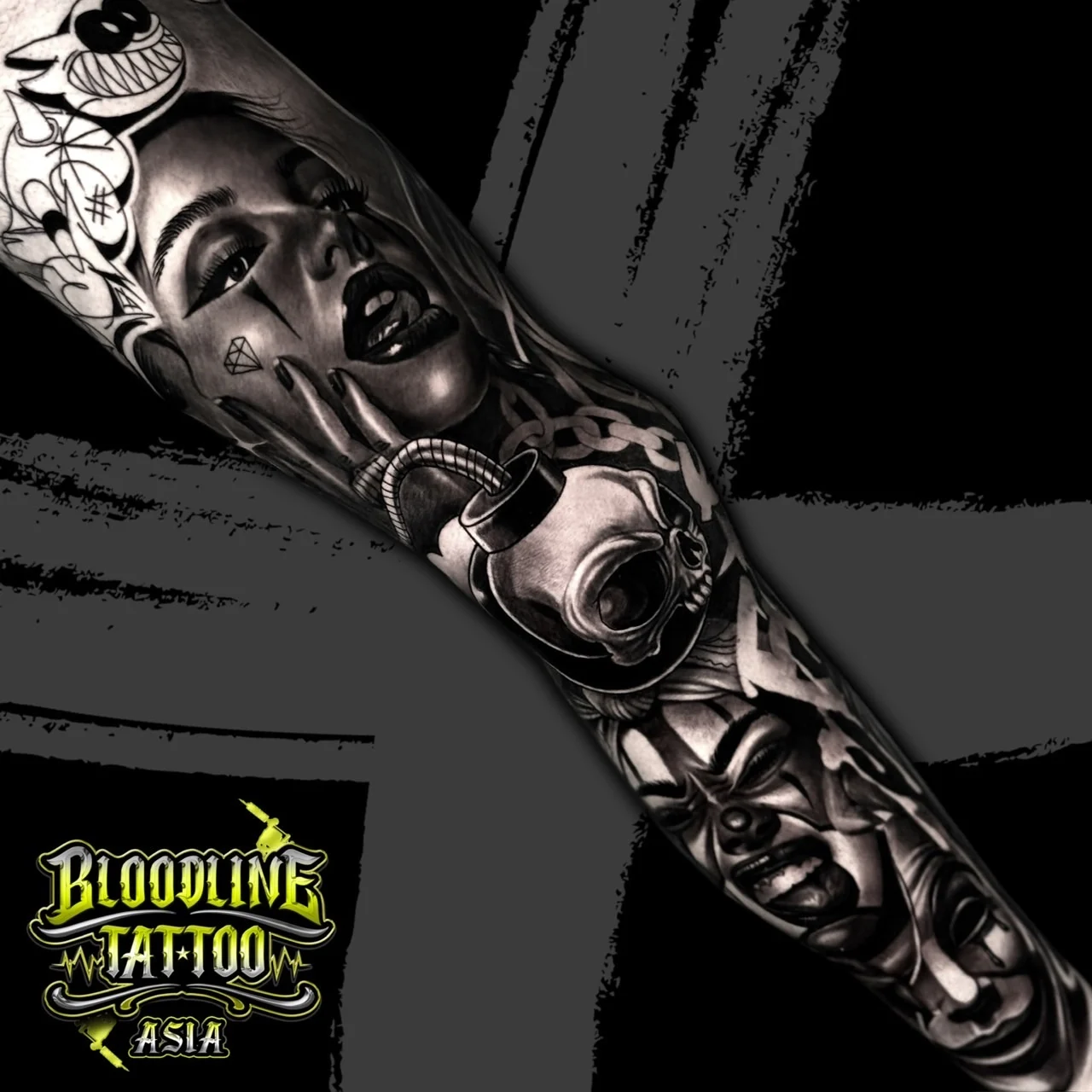 Detailed black and grey Chicano sleeve with payasa portraits, chained bomb skull, and a smile-now cry-later drama mask at Bloodline Tattoo Bangkok.