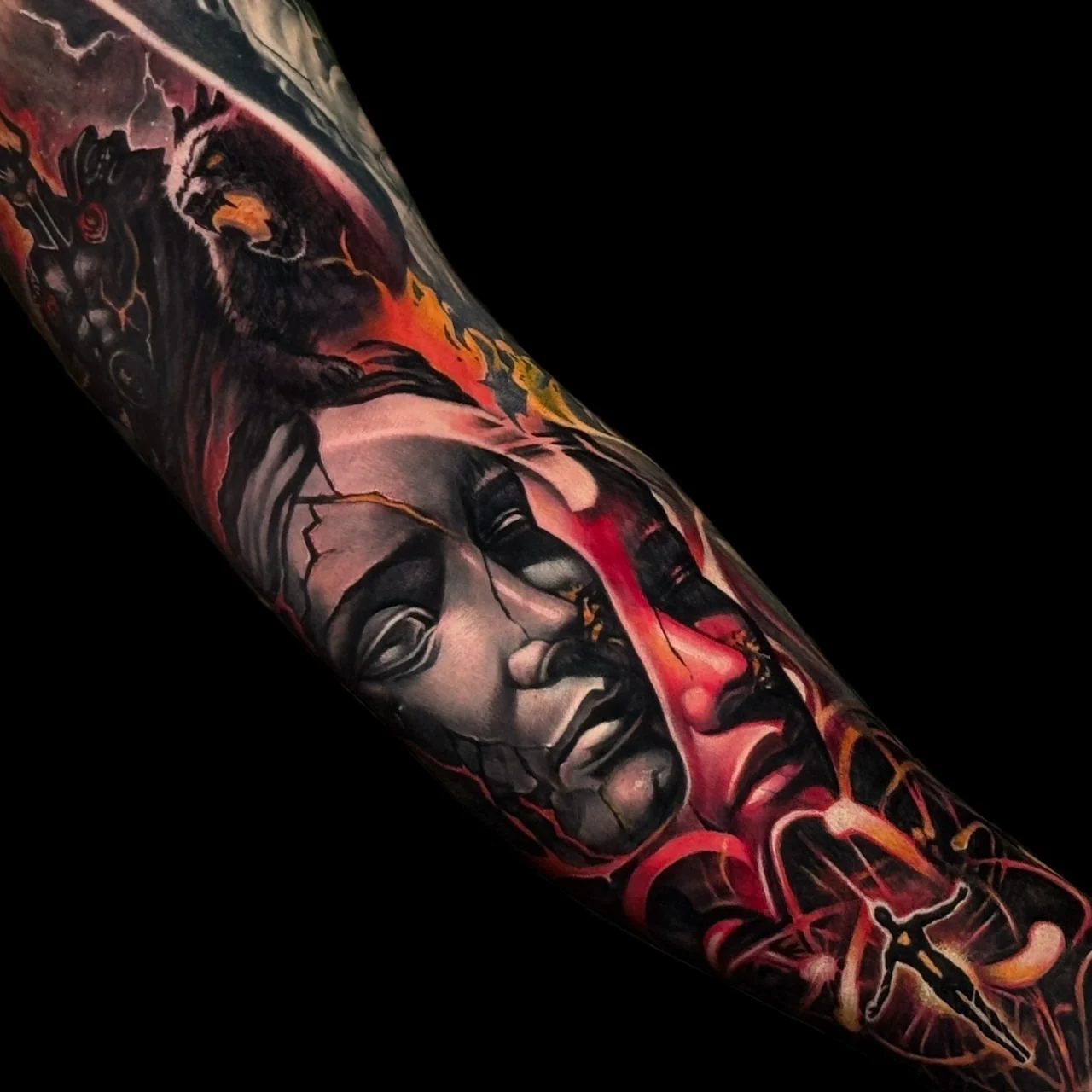 Colour surreal forearm sleeve tattoo with cracked stone faces, a dark owl, red energy, and a silhouetted figure at Bloodline Tattoo Bangkok.