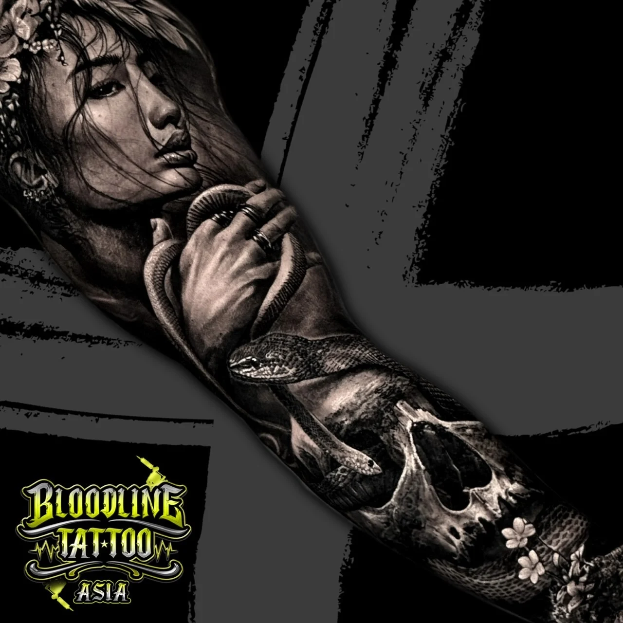 Black and grey Japanese realism sleeve with woman portrait, coiled snake, human skull, and cherry blossoms at Bloodline Tattoo Bangkok.