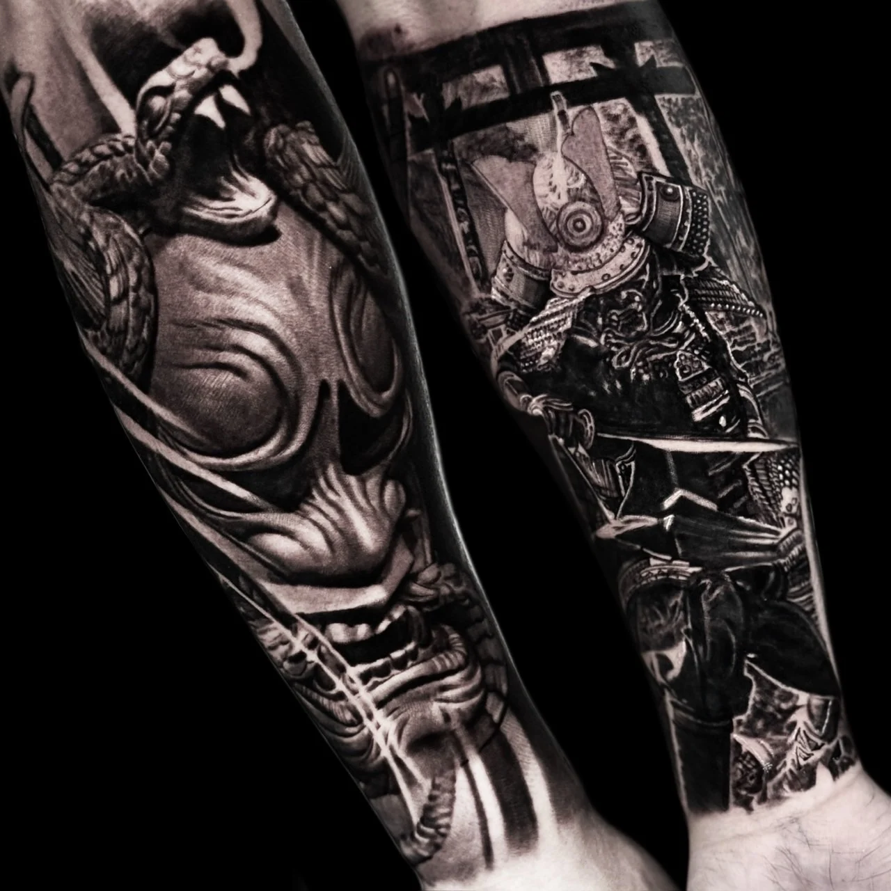 Black and grey Japanese forearm tattoos of a Hannya mask with striking snake and a samurai with katana before a torii at Bloodline Tattoo Bangkok.