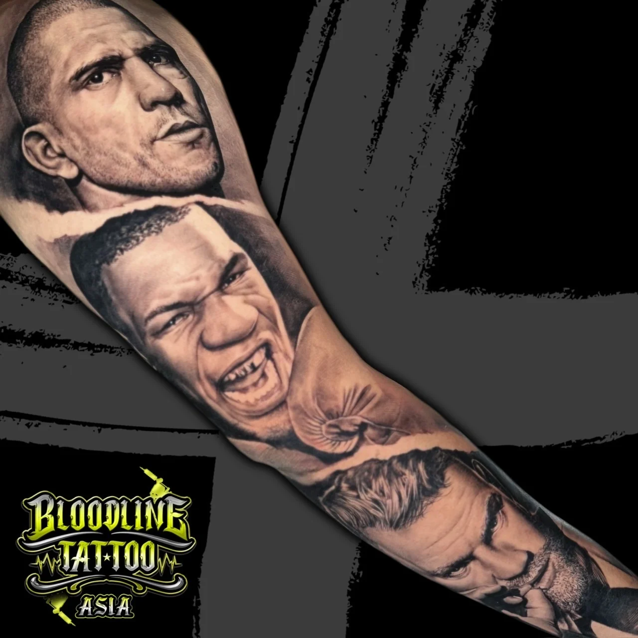 Black and grey portrait realism arm sleeve with stacked male portraits including Mike Tyson in boxing gloves between two detailed faces at Bloodline Tattoo Bangkok.