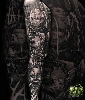 A black and grey realism full sleeve featuring Harley Quinn with a baseball bat and the Joker's manic grin with "HAHAHA" lettering, at Bloodline Tattoo Bangkok.